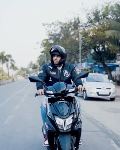 A still from the #PlaySmartPlayEpic film: a rider on the TVS NTORQ SuperSquad Edition